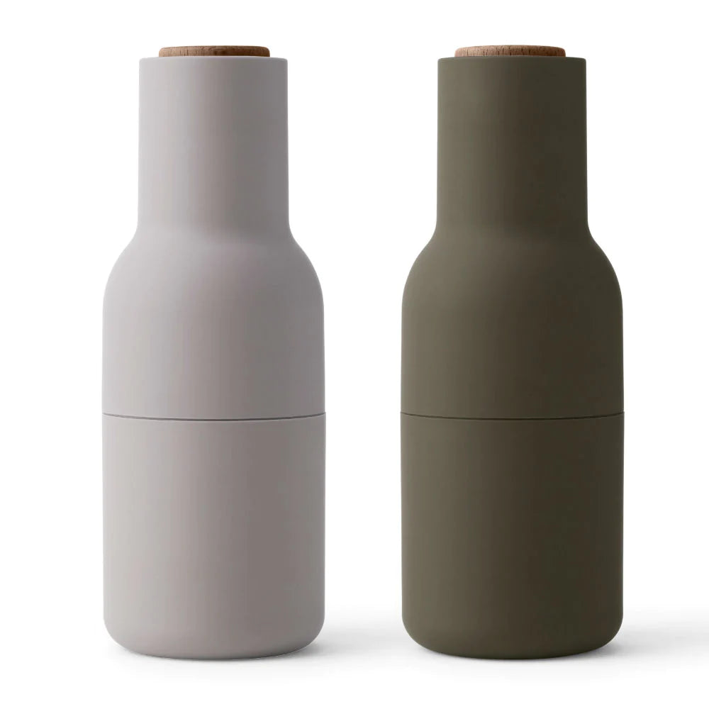 Menu Bottle Grinder Set -Green / Beige. The form, shaped more like a bottle, cleverly tricks the user to encourage a more playful and experimental interaction with the product.